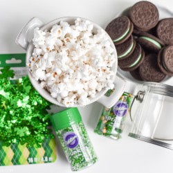 Mint Oreo Chocolate Popcorn - white chocolate covered popcorn made with mint Oreo cookies and shamrock sprinkles. Great St. Patrick’s Day treat!