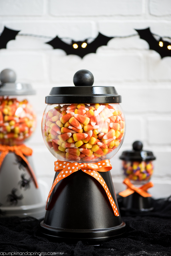 How to make a Halloween candy jar made out of a terra cotta pot, saucer, a glass bowl and wooden knob. Perfect for decorating and displaying your favorite Halloween treats!