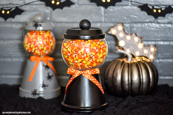 How to make a Halloween candy jar made out of a terra cotta pot, saucer, a glass bowl and wooden knob. Perfect for decorating and displaying your favorite Halloween treats!