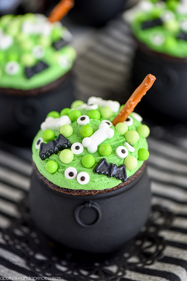 Cauldron Cupcakes -Hosting a Halloween party this year or need a cute and easy treat idea? These Cauldron Cupcakes are perfect for parties and easy to make with kids.