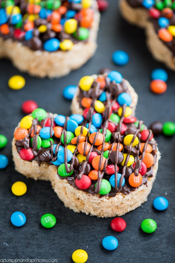 Mickey Rice Krispies Treats – Disneyland inspired Mickey shaped Rice Krispies treats dipped in chocolate and topped with mini M&M's.