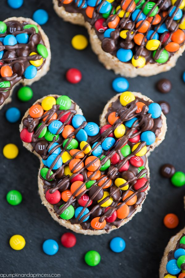 Mickey Rice Krispies Treats – Disneyland inspired Mickey shaped Rice Krispies treats dipped in chocolate and topped with mini M&M’s.