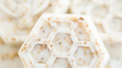 Handmade honey & oatmeal soap made with vanilla essential oil in a bee and honeycomb shape.
