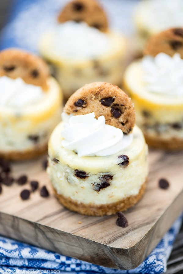 Mini Chocolate Chip Cheesecakes – bite size cheesecakes made with miniature chocolate chips, whipped cream and topped with chocolate chip cookies.