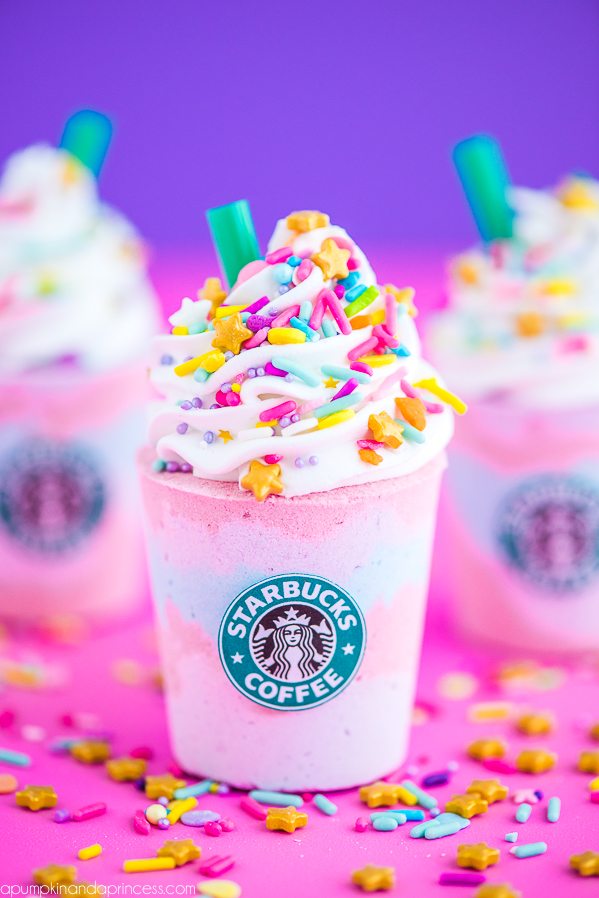 DIY Unicorn Frappuccino Bath Bomb – how to make Starbucks Unicorn Frappuccino inspired bath bombs with layers of pink, purple and blue. Then topped with icing, sprinkles and a classic green straw.
