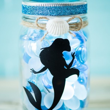 DIY The Little Mermaid Mason Jar Light - create an ocean inspired mason jar night light with a vinyl Ariel decal and LED light.