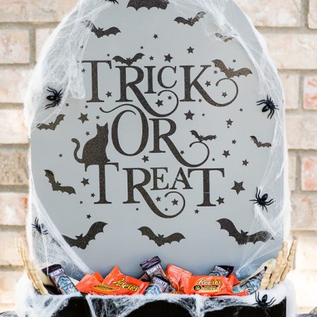 DIY Halloween Candy Holder – create a Tombstone Candy Holder out of a 2x2 piece of plywood and paint!