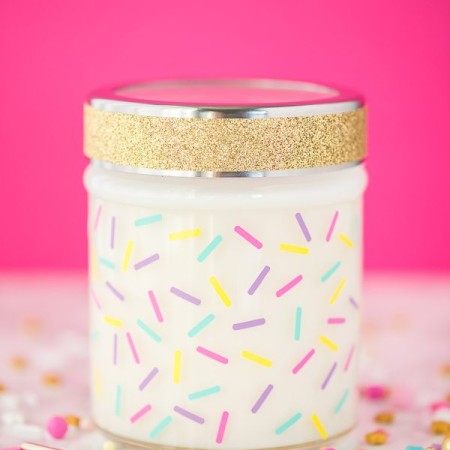 How to make birthday cake scented candles. Soy wax candles made in a jar and decorated with adhesive vinyl sprinkles.