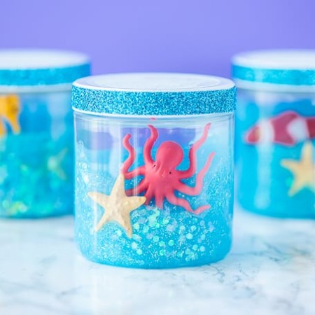 Glitter Ocean Slime jars for an under the sea party or summer boredom buster activity