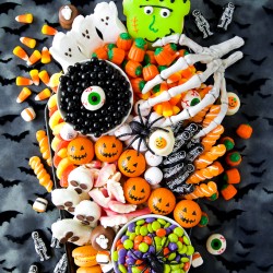 Create a festive Halloween Candy Charcuterie Board on a coffin platter filled with Halloween treats. Perfect for a Halloween party or movie night!