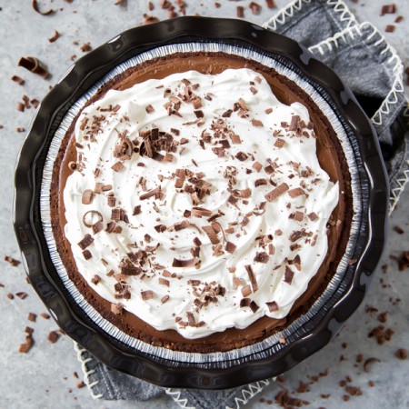 a rich chocolate cream pie with whipped cream