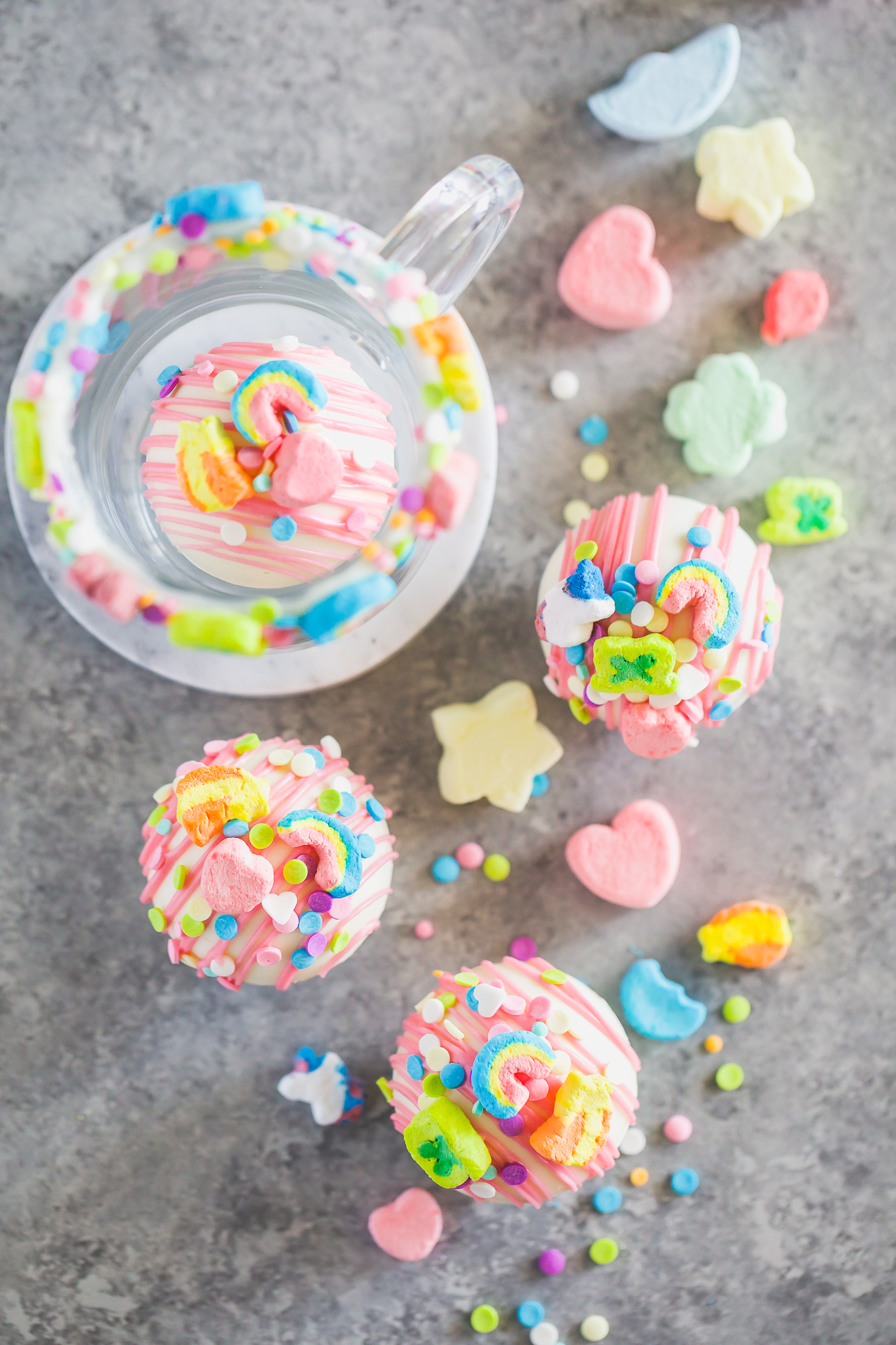 colorful hot cocoa bombs with rainbow marshmallows