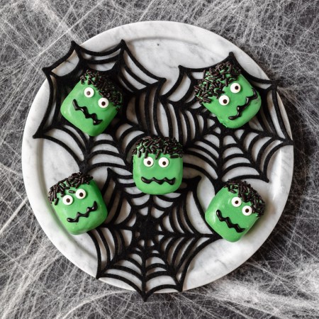 chocolate cookie truffles decorated in green chocolate and candy eyes