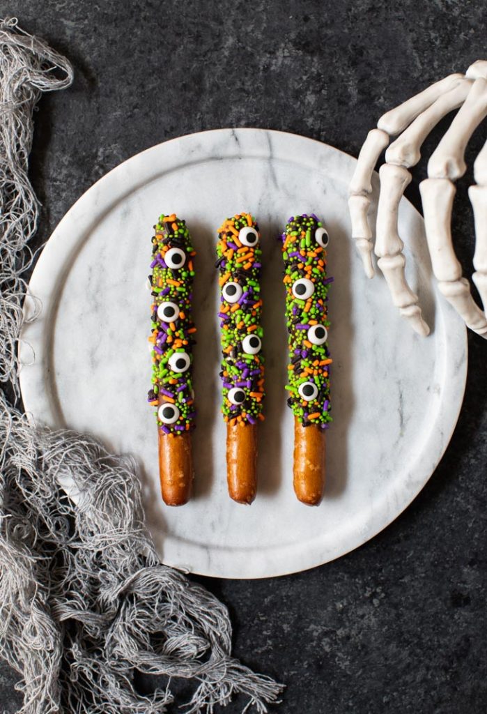 Halloween sprinkles and candy eyes pretzels