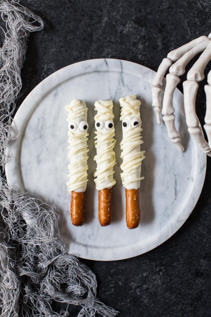 white chocolate covered mummy pretzel rods