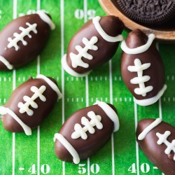 easy no-bake oreo ball truffles shaped into footballs