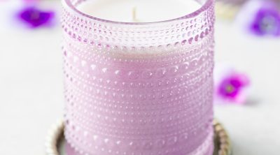 Spring floral scented soy candle in purple hobnail jar