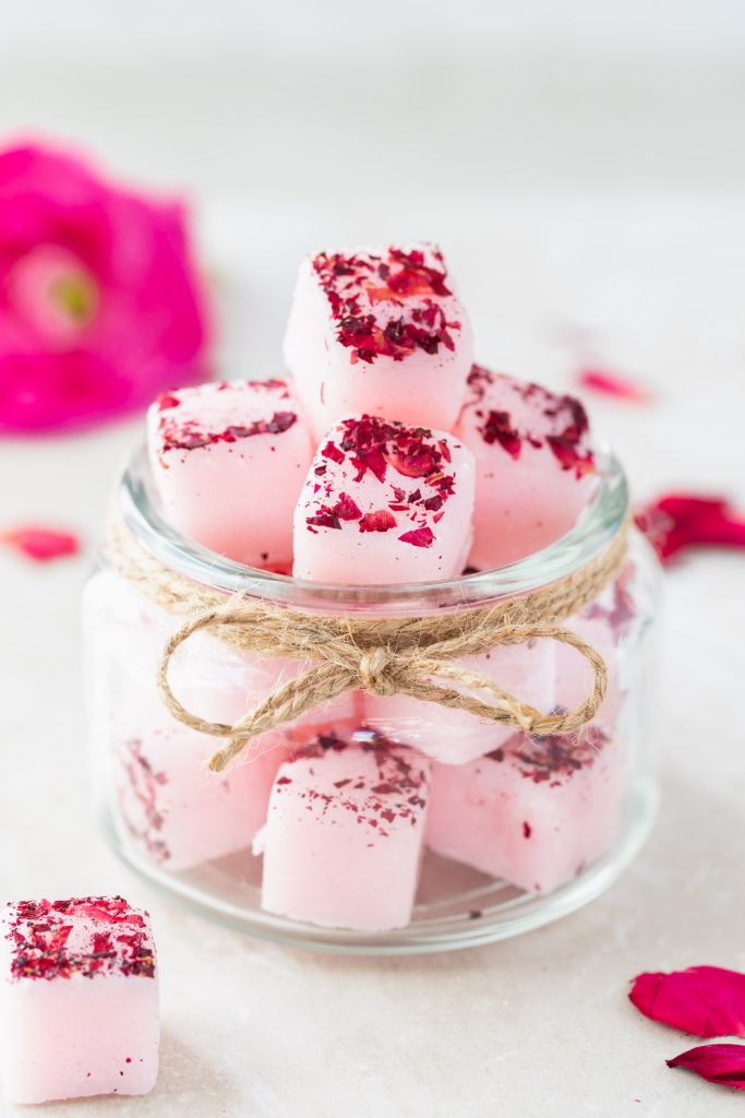 pink rose petal sugar scrub cubes in a mason jar