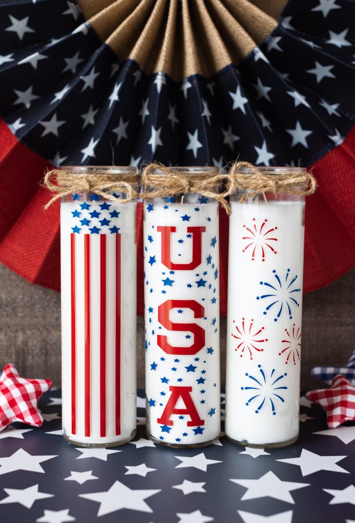 tall white candle jars with vinyl decorations in American flag designs
