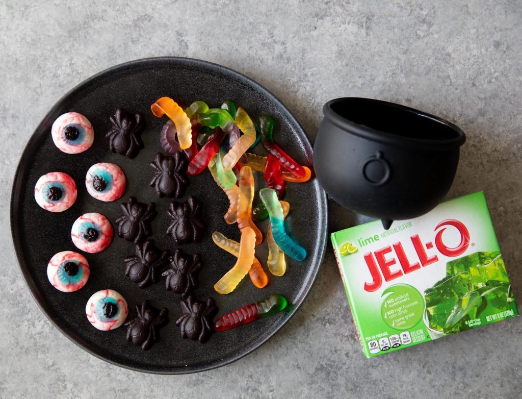 green jello decorated with Halloween candy