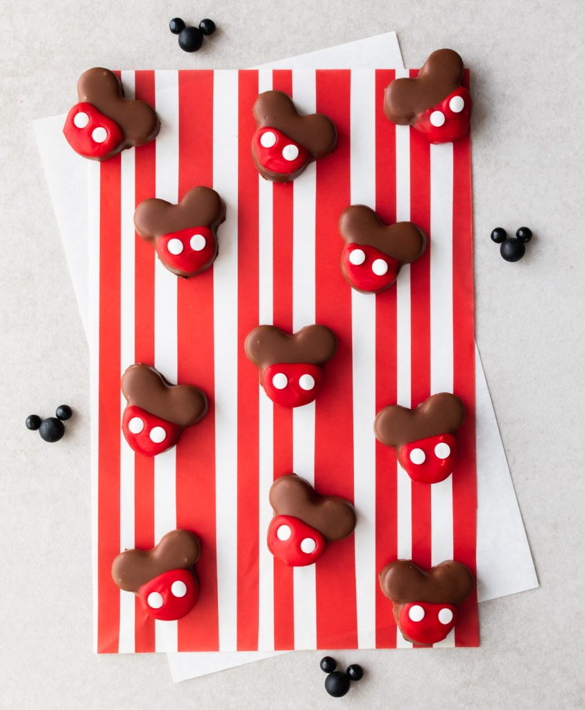 Milk chocolate Mickey oreo truffles with red candy coating and white sprinkles