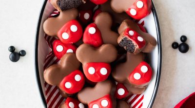 Chocolate dipped Mickey shaped Oreo balls (truffles) with red candy coating and white sprinkles