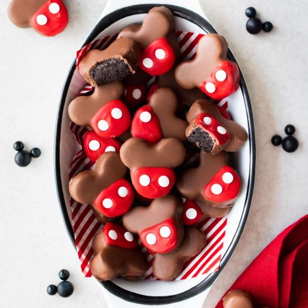 Chocolate dipped Mickey shaped Oreo balls (truffles) with red candy coating and white sprinkles