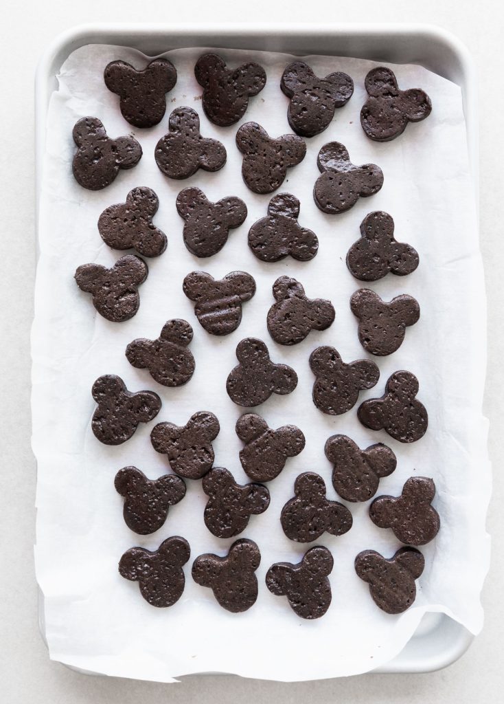 Mickey cookie cutter Oreo truffles on parchment paper