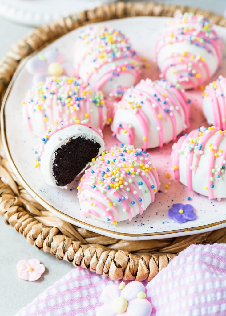 Chocolate oreo cookie ball truffle covered in chocolate and pastel sprinkles