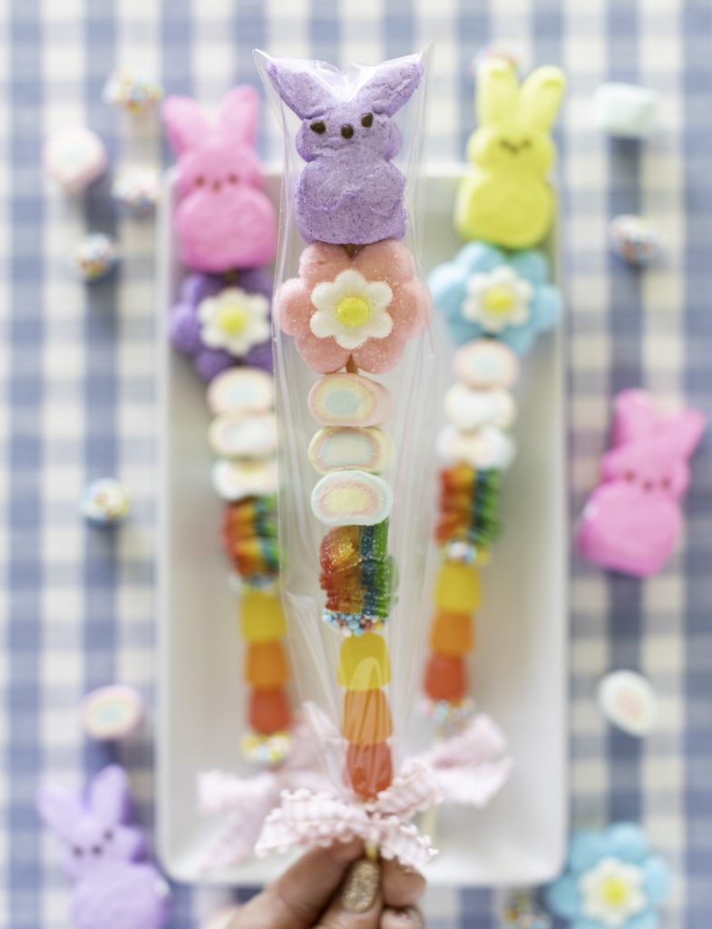 Easter candy kabob gifts wrapped in clear treat bags with gingham ribbon